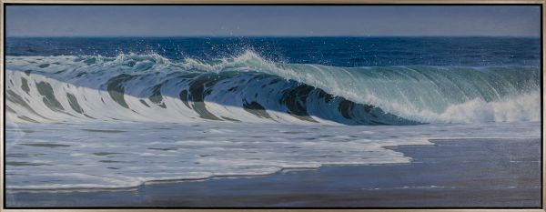 A long blue ocean wave crashes onto a sandy shore, with white foam curling and a clear horizon in the background, in a framed seascape.
